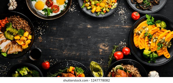 Assortment Of Food. Salad, Avocado, Quail, Mushrooms, Pumpkin. On A Black Background. Top View. Free Space For Your Text.