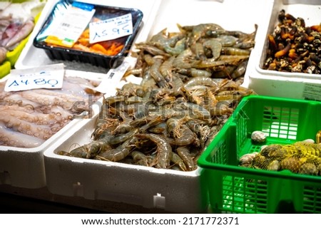 Assortment of fresh daily catch of fishes, seashells, molluscs on ice on fish market in Spain Foto stock © 