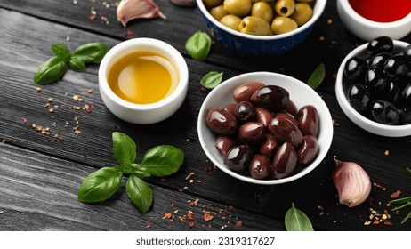 Assortment of fresh green, kalamata and black olives in bowl. Healthy snack - Powered by Shutterstock