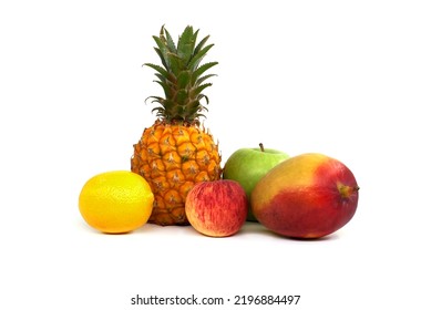 Assortment of fresh healthy fruits including an pineapple, mango, apple and lemon isolated on a white background - Powered by Shutterstock