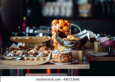 Assortment Of Fresh Pastry And Mandarin On Table In Buffet