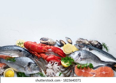 Assortment Of Fresh Raw Fish And Seafood. Healthy And Balanced Diet Or Cooking Concept. Top View, Copy Space