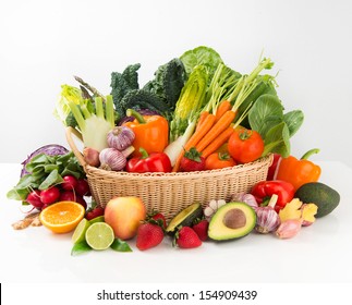 Assortment of Fresh Vegetables and Fruits in Basket on White Background - Shutterstock ID 154909439