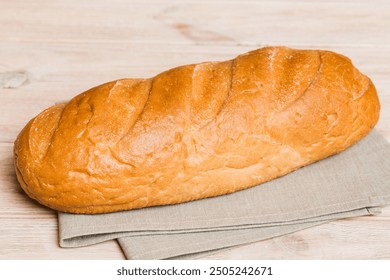 Assortment of freshly baked bread with napkin on rustic table top view. Healthy unleavened bread. French bread. - Powered by Shutterstock