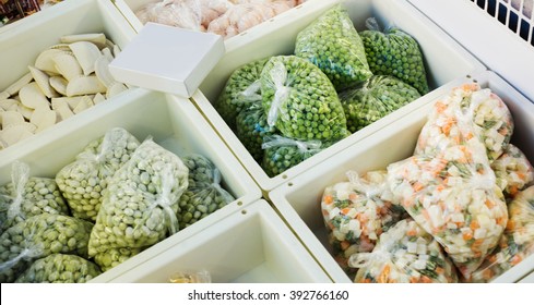 Assortment Of Frozen Vegetables And Dumplings In Supermarket Fridge