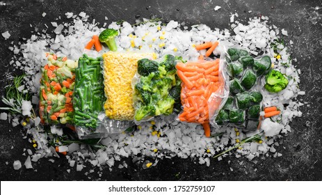Assortment of frozen vegetables on ice. Stocks of food. Top view. Free space for your text. - Shutterstock ID 1752759107