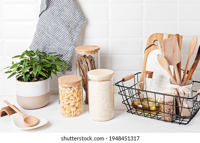 Assortment of grains, cereals and pasta in glass jars and kitchen utensils on wooden table. Healthy balanced food, sustainable lifestyle, zero waste storage, eco friendly idea - Powered by Shutterstock