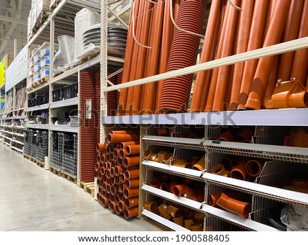 Assortment of a hardware store, pipes. Building materials and manufactured goods are stacked and put up for sale in a hardware store