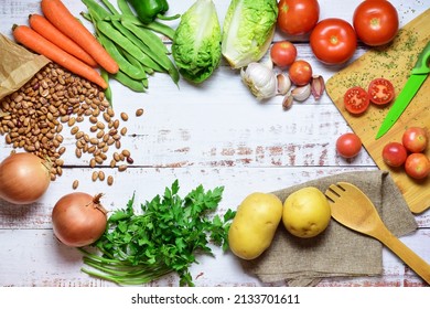 Assortment of healthy foods, vegetables, legumes, on rustic white wooden boards. Zenith view. - Powered by Shutterstock