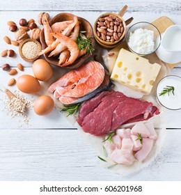 Assortment Of Healthy Protein Source And Body Building Food. Meat Beef Salmon Shrimp Chicken Eggs Dairy Products Milk Cheese Yogurt Beans Quinoa Nuts Oat Meal