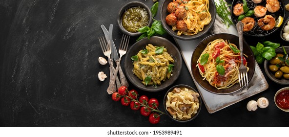 Assortment Of Italian Pasta With Traditional Sauces For Dinner On Dark Background. Homemade Food Concept. Top View