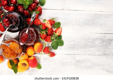 assortment of jams, seasonal berries, apricot, mint and fruits. marmalade or confiture - Shutterstock ID 1419100838