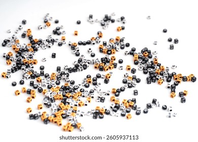 An assortment of letters and number scattered randomly across a black background, creating a dynamic and abstract composition; letter and number background