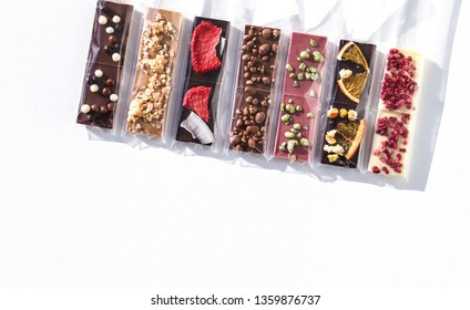 Assortment of mini chocolate bars isolated on white background. Natural light 