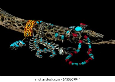 Assortment Of Native American Turquoise And Silver Jewelry On Black BG With Cholla Cactus