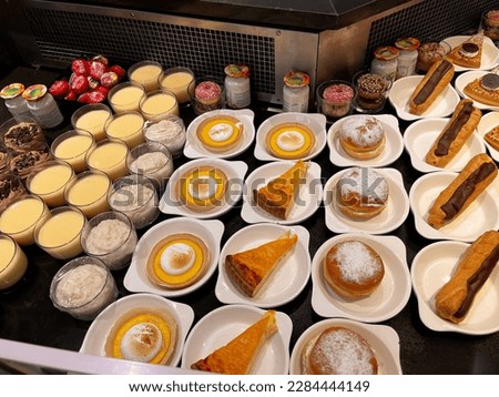 Assortment of pastries for sale in a restaurant. Desserts. French cuisine.