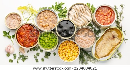 An assortment of processed food with long shelf life, canned fish and vegetables.