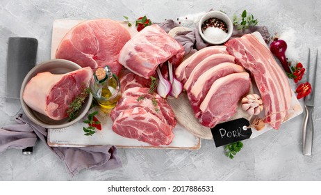 Assortment of raw pork meat on light grey background. Organic gourmet food concept. Top view, flat lay - Shutterstock ID 2017886531
