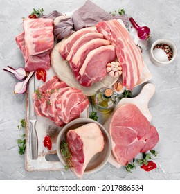 Assortment Of Raw Pork Meat On Light Grey Background. Organic Gourmet Food Concept. Top View, Flat Lay