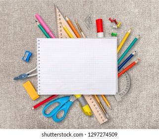 Assortment  of School supplies on  background - Shutterstock ID 1297274509
