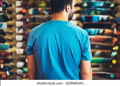 Assortment skateboard isolated in store shop, person choosing and buy color skates on backgraund sun flare, healthy and activity lifestyle concept close up, man consider sport board for driving - Powered by Shutterstock