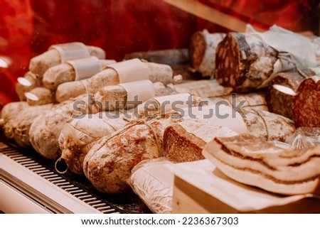 Assortment of smoked sausage and salami in a supermarket. Delicacy and butchery shop
