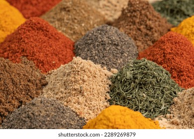 Assortment spices and herbs for cooking. Spice and seasoning. Various fragrant spice market. Heap different Asian Spices lies on wooden background