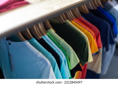 Assortment Of Summer And Autumn Clothing In Modern Garment Store Interior