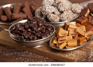 Assortment of sweet confectionery with chocolate candies and pralines. Children's holiday table with chocolate sweets