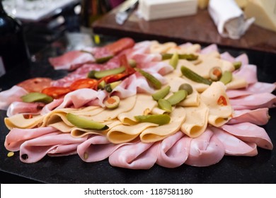 Assortment Of Tasty And Delicious Italian Antipasto Platter. Chorizo, Salami Sausage, Bologna And Deli Meats With Cheese And Pickles. A Perfect Appetizer, Party Snack, Or Good Accompany With Wine