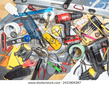 Assortment of tools and miscellaneous items of a handyman.