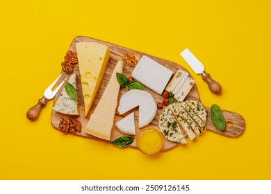 An assortment of various cheeses arranged on a board, highlighting different textures, colours, and types, perfect for a tasting or appetizer - Powered by Shutterstock