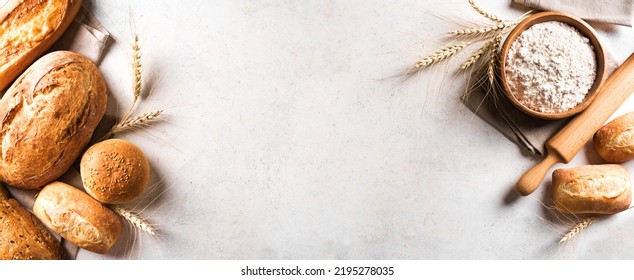 Assortment of various delicious freshly baked bread and flour ingredient on white background, banner, copy space. Variety of artisan bread and ears of wheat. - Powered by Shutterstock