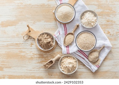 Assortment of various gluten free flour,  without carbohydrate (almond and coconut flour, psyllium husk powder, rough-ground flaxseed flour) - Powered by Shutterstock