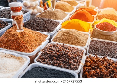 assortment of various oriental spices on the counter at the Asian bazaar in close-up - Powered by Shutterstock