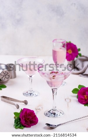 Assortment of various pink cocktails with rose syrup. Martin, Margarita and champagne