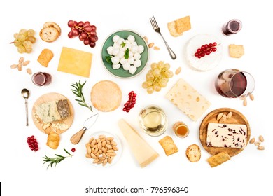 An Assortment Of Various Types Of Cheese With Wine, And Grapes, Shot From Above On A White Background