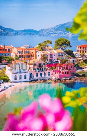 Assos, Greece. Picturesque village Kefalonia, Ionian islands. Beautiful colorful houses and turquoise colored bay.