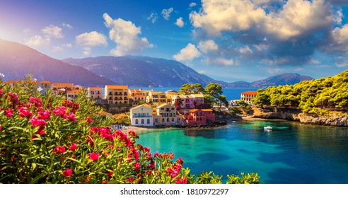 Assos village in Kefalonia, Greece. Turquoise colored bay in Mediterranean sea with beautiful colorful houses in Assos village in Kefalonia, Greece, Ionian island, Cephalonia, Assos village.
