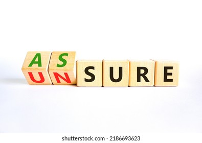 Assure or unsure symbol. Turned wooden cubes and changed the concept word unsure to assure. Beautiful white table, white background, copy space. Business and assure or unsure concept. - Shutterstock ID 2186693623