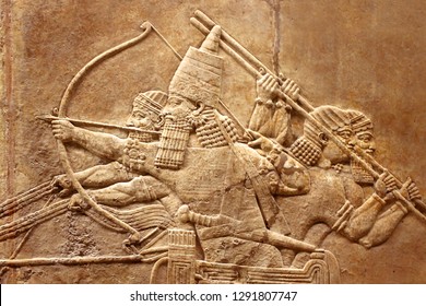 Assyrian relief on wall, Ancient carving on stone from Middle East history. Remains of culture of past civilization, Sumerian art background. History of Babylon, Assyria, Mesopotamia and Iraq theme.