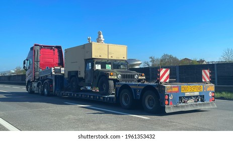 Asten, Austria, 23 April 2021, Low Loader Transporting An Amrican Army Hummer H1 On The Highway A1 Westautobahn