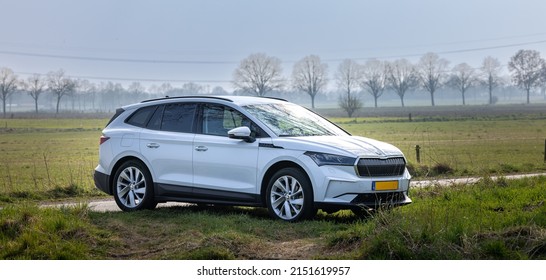 ASTEN, NETHERLANDS - Mar 25, 2022: A Beautiful Shot Of The Skoda Enyaq Electric Car Parked Next To The Road In A Countryside Area