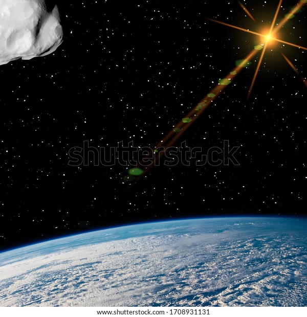 Asteroid above the earth. Elements of this image\
furnished by NASA.\
