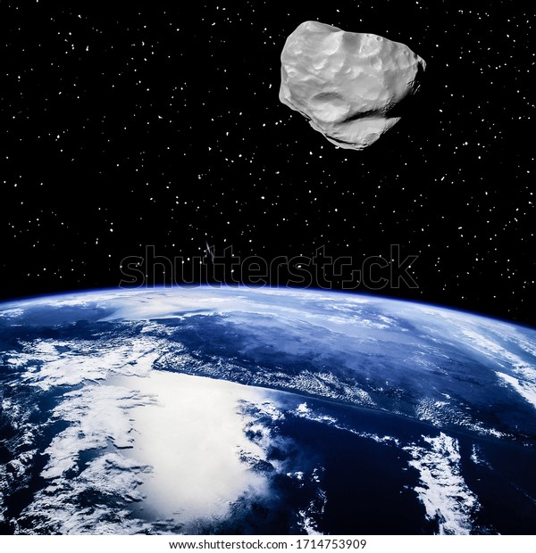 Asteroid above the earth. Elements of this image\
furnished by NASA.\
