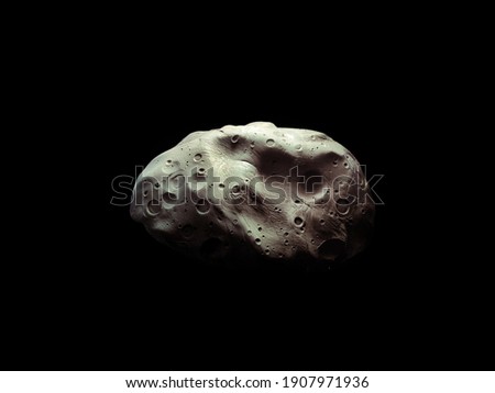 Asteroid with craters in space, surface of the space stone. Meteorite on a black background.