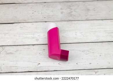 A Asthma Drug Inhaler On Wooden Table. World Asthma Day.