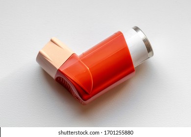 Asthma Inhaler Closeup On A White Table.