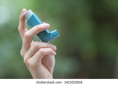 Asthma Medecine Inhaler Holded By A Man