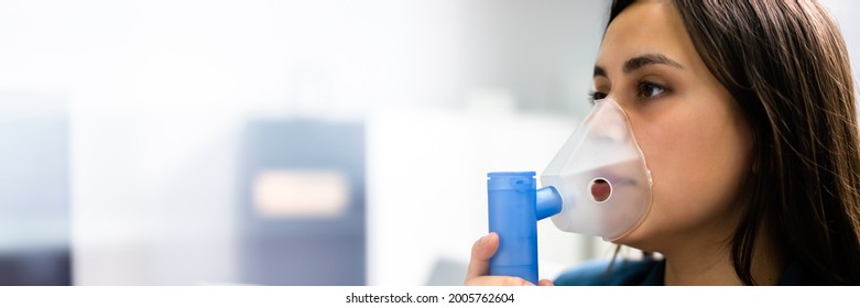 Asthma Patient Breathing Using Oxygen Mask And COPD Nebulizer